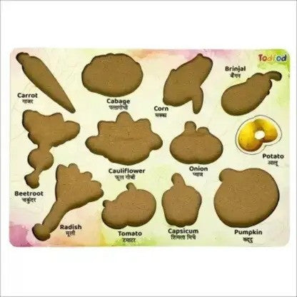 Educational toy with vegetable-shaped cutouts and labels on a light background