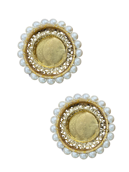 Pair of gold and pearl earrings on a white background