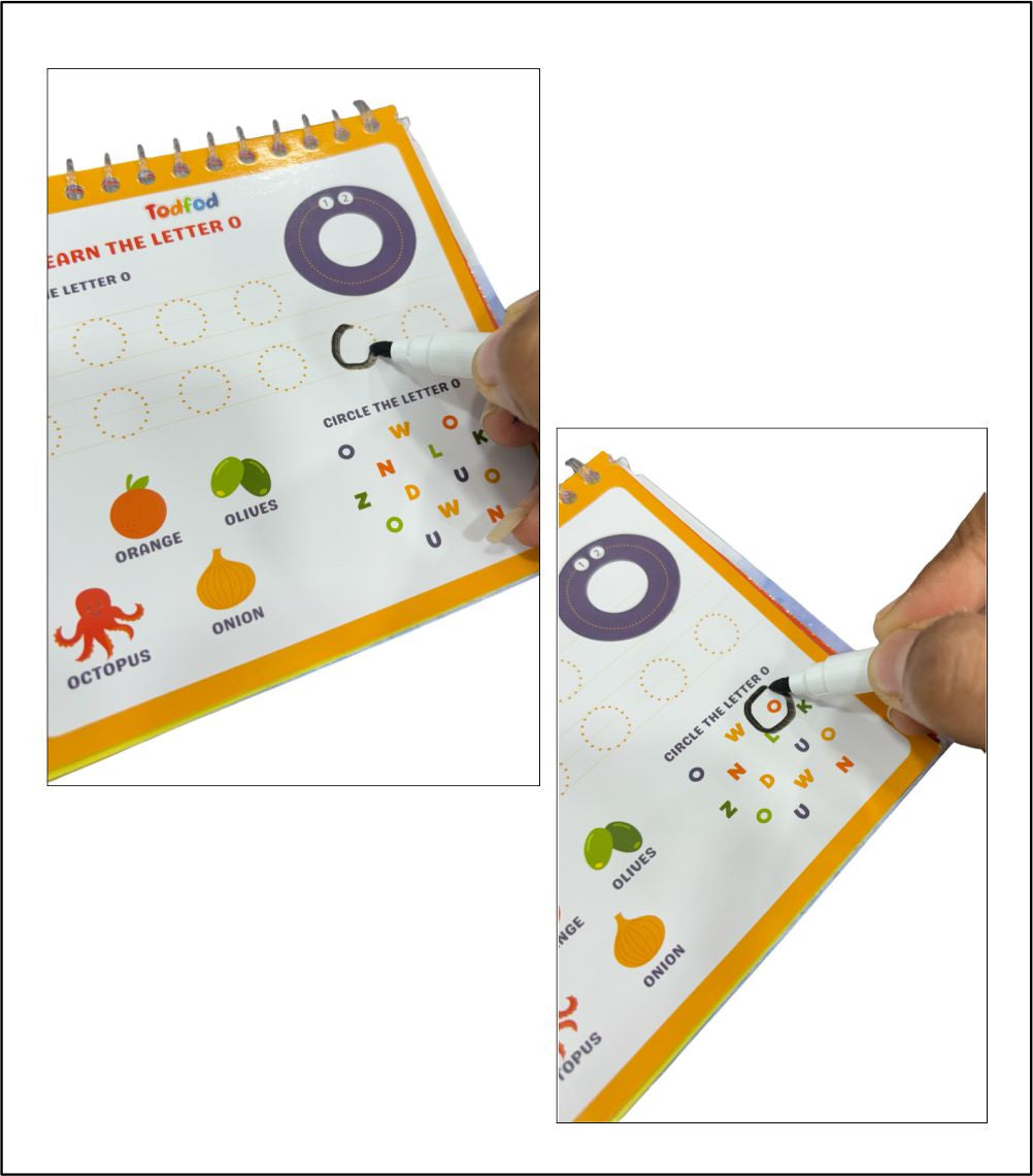 Educational book with letter tracing activity, held by a hand with a pen.