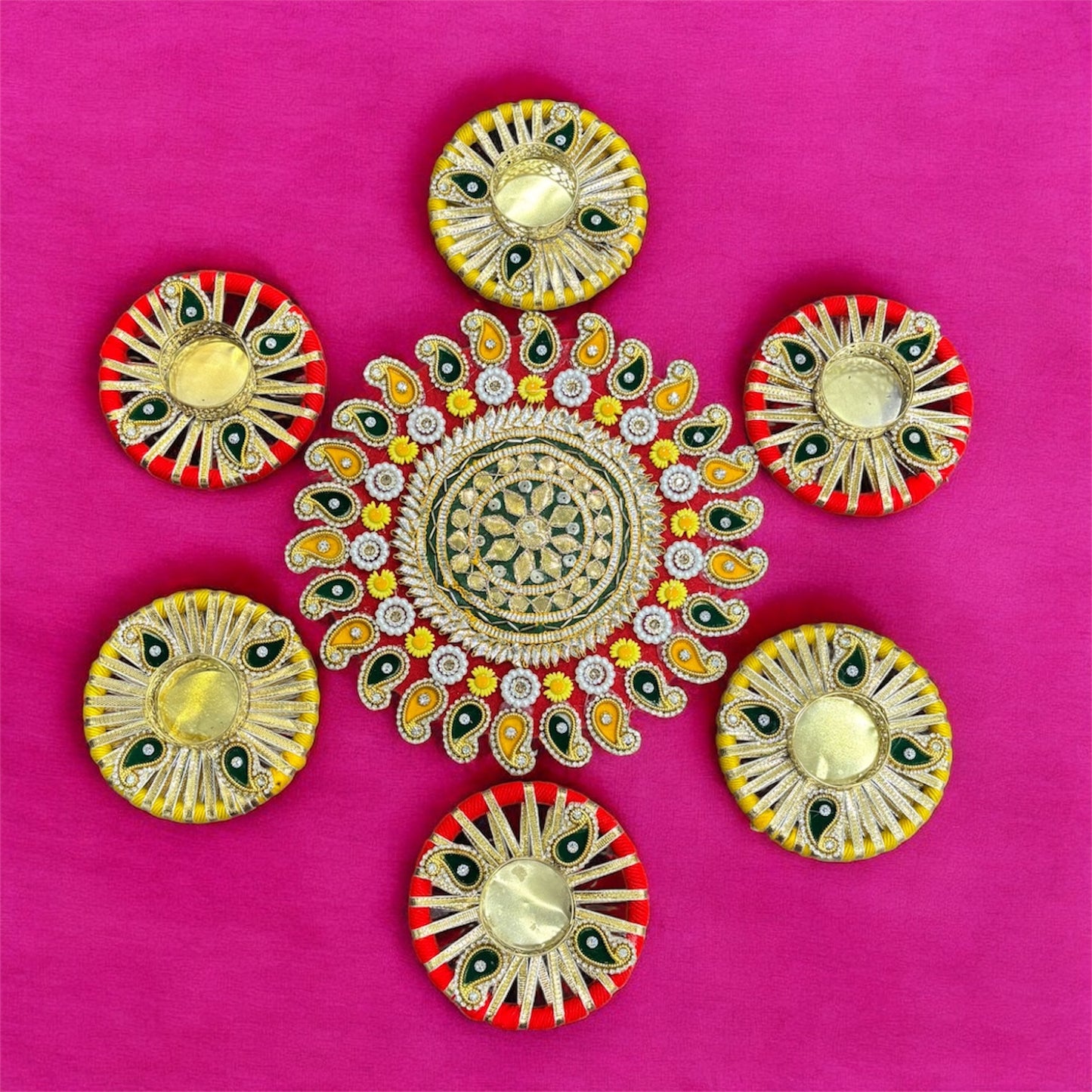 Decorative circular designs with colorful patterns on a pink background