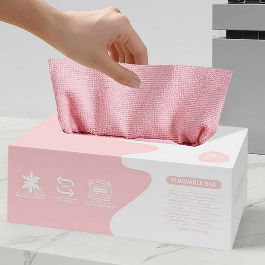 Hand reaching for a pink reusable bag from a box labeled 'Removable Rag' on a light background.