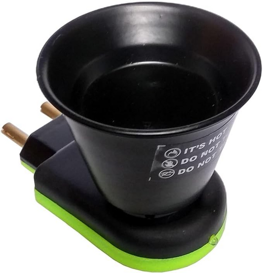 Black electric mug with green base on a white background