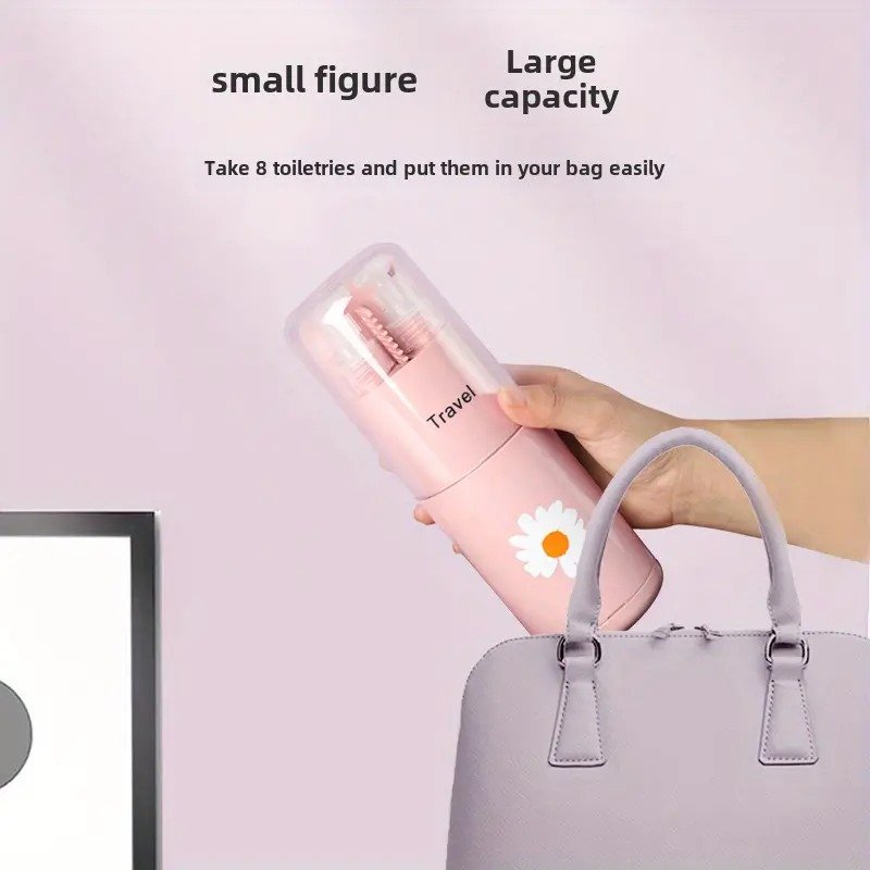 Pink travel bottle with a daisy design being placed into a gray handbag against a light pink background.
