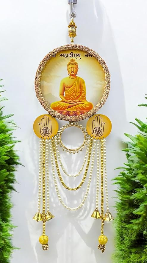 Decorative hanging with Buddha image and bells against a white background