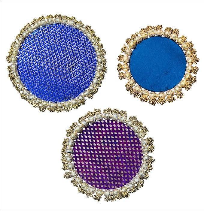 Three circular coasters with decorative frames on a white background