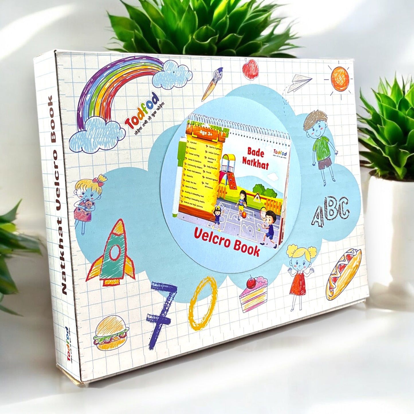 Colorful Velcro book packaging with educational illustrations on a white surface.