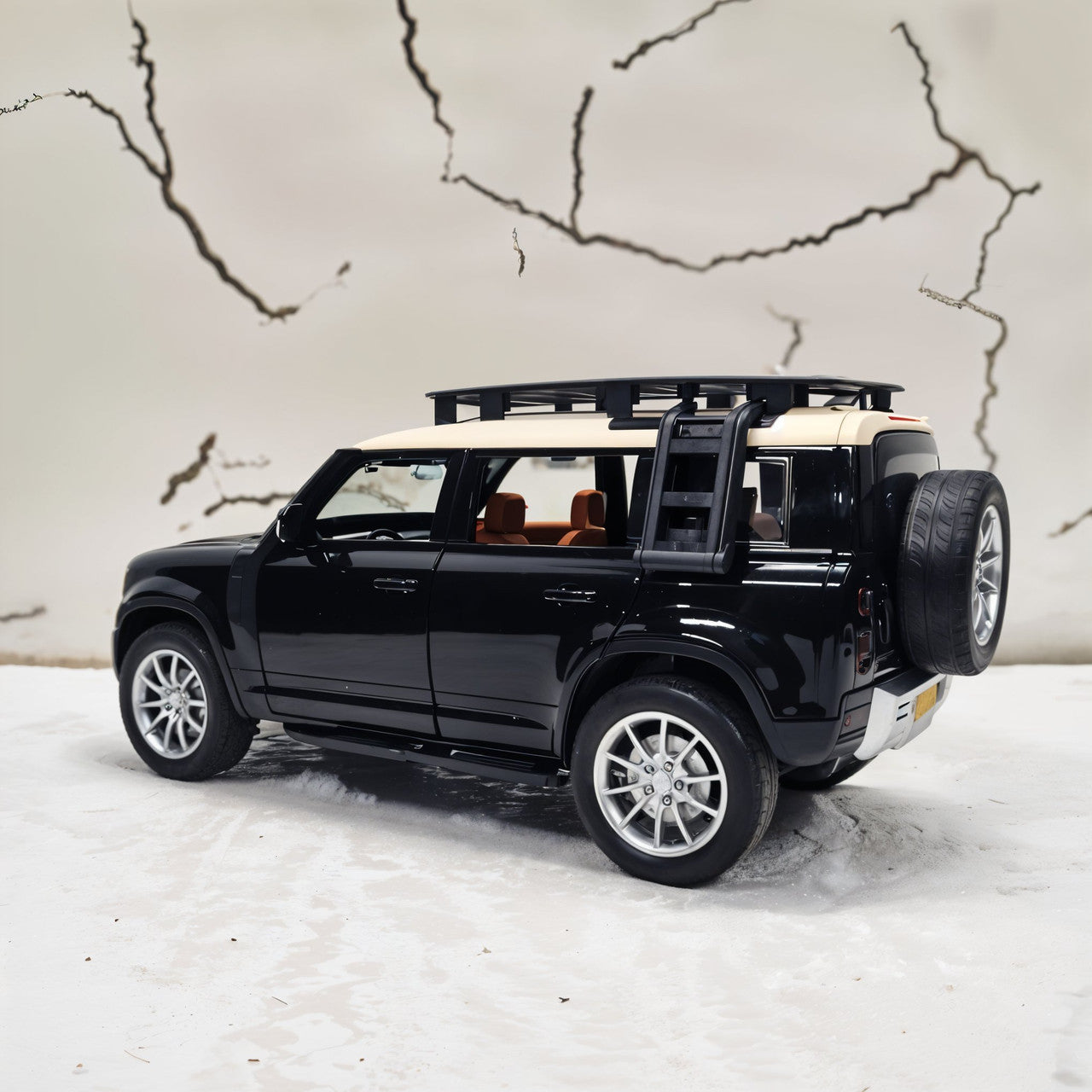 Black SUV model with open doors on a white surface with a map background