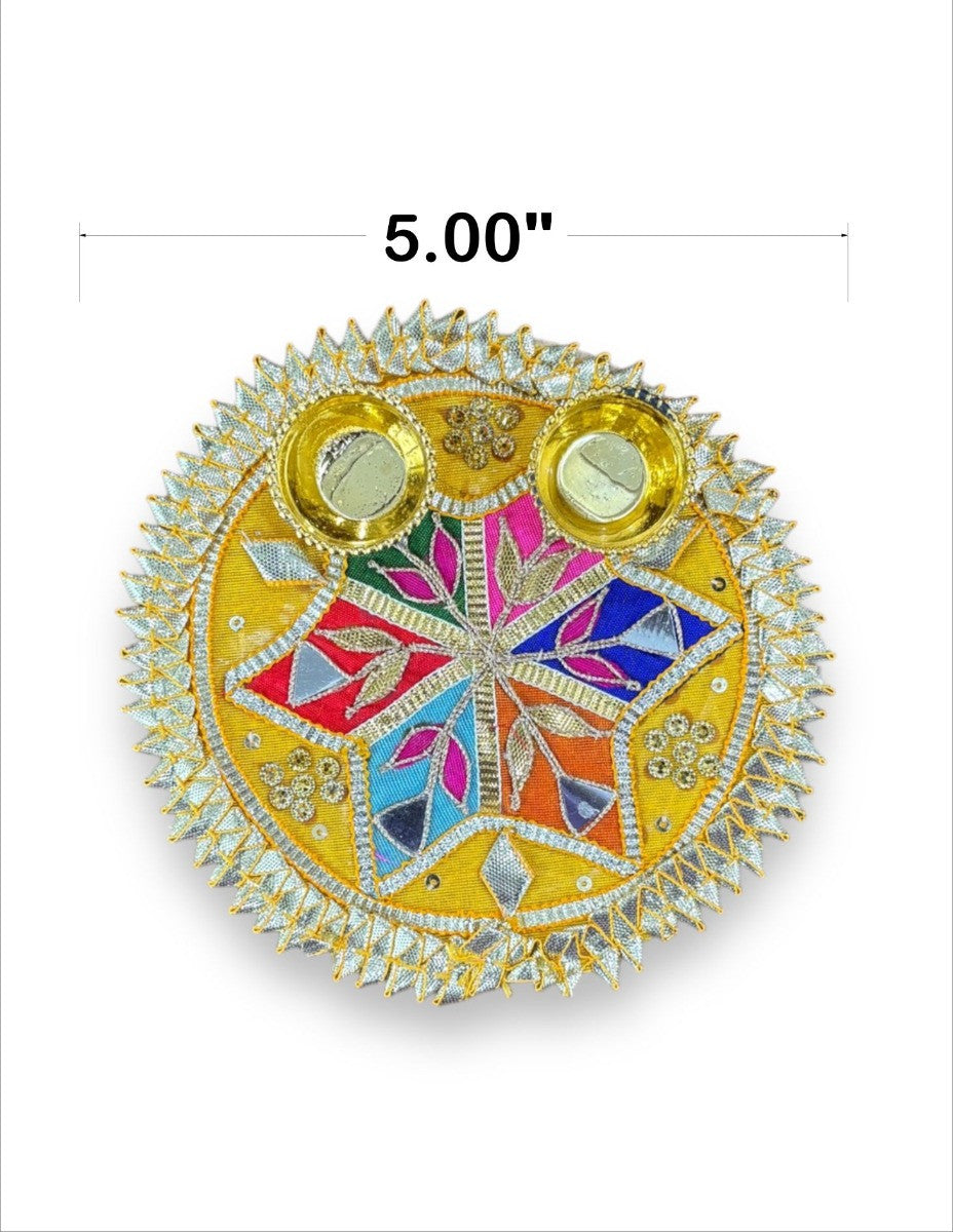 Decorative round object with colorful design and gold accents, labeled '5.00"'.