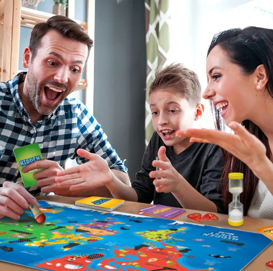 Family playing a board game together, with colorful game pieces on a table.