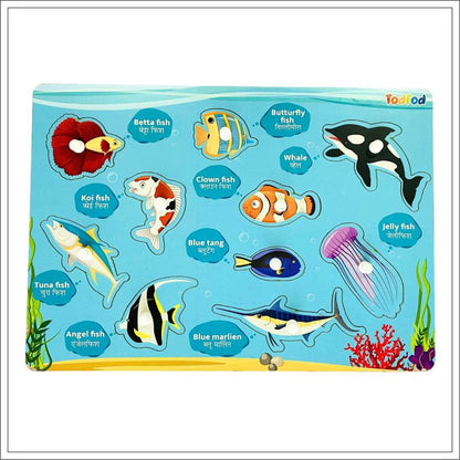 Educational toy with ocean-themed puzzles and labels on a blue background