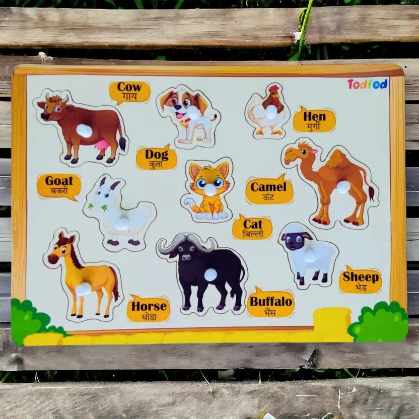 Educational animal puzzle with labels on a wooden board