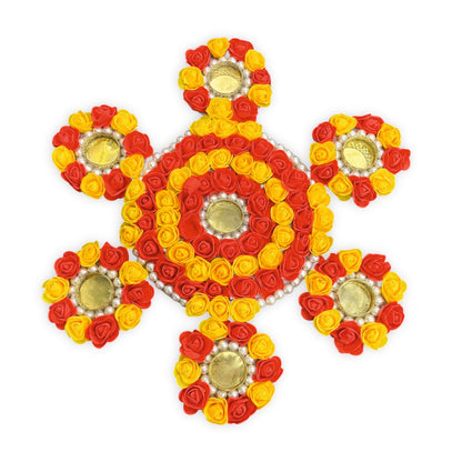 Decorative design made of red, yellow, and gold flowers on a white background