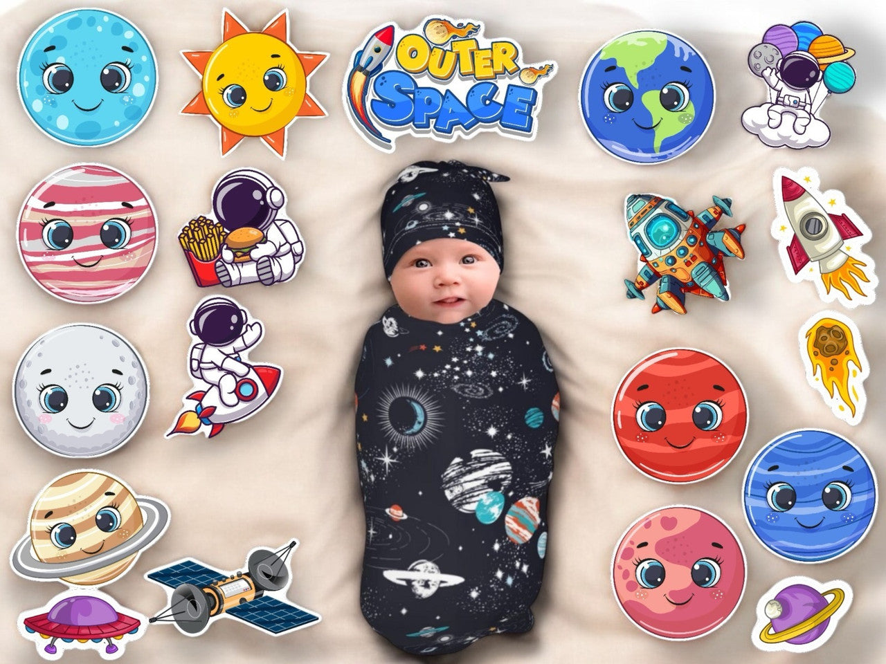 Baby swaddled in a space-themed blanket with surrounding space-themed stickers on a beige background
