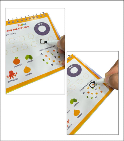 Educational book with letter tracing activity, held by a hand with a pen.