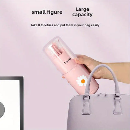 Pink travel bottle with a daisy design being placed into a gray handbag against a light pink background.