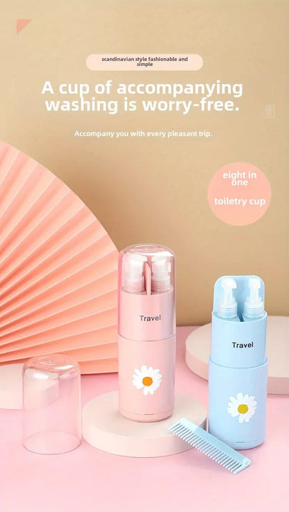 Set of travel cups with daisy designs on a pink background