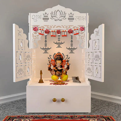 White decorative altar with a statue of a deity on a gray floor.