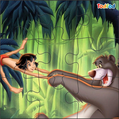 Jigsaw puzzle with characters from 'The Jungle Book' in a jungle setting, featuring Baloo and Mowgli.