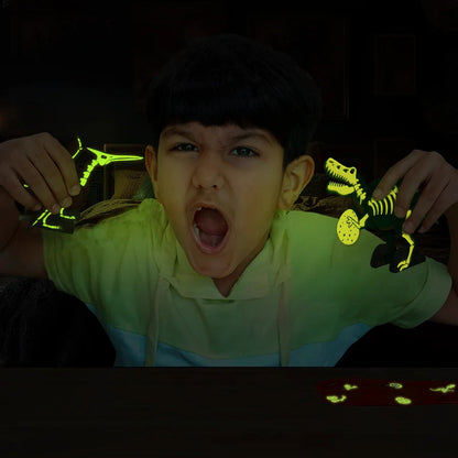 Child holding glow-in-the-dark dinosaur toys in a dark setting