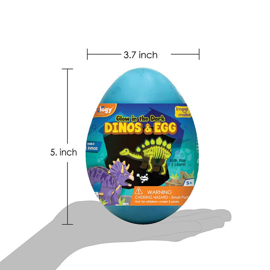 Toy dinosaur egg with glow-in-the-dark features, held in a hand for scale.