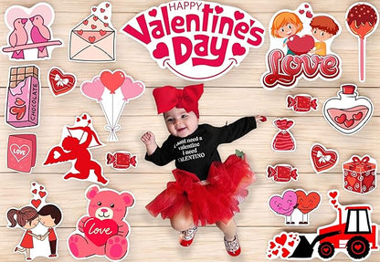 Child in Valentine's Day-themed outfit surrounded by decorative stickers on a wooden background