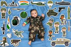 Baby in camouflage outfit surrounded by military-themed stickers on a blue background