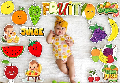 Baby in a onesie surrounded by colorful fruit-themed stickers on a textured background