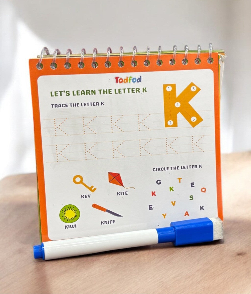 Educational children's book with a marker, teaching the letter 'K'.