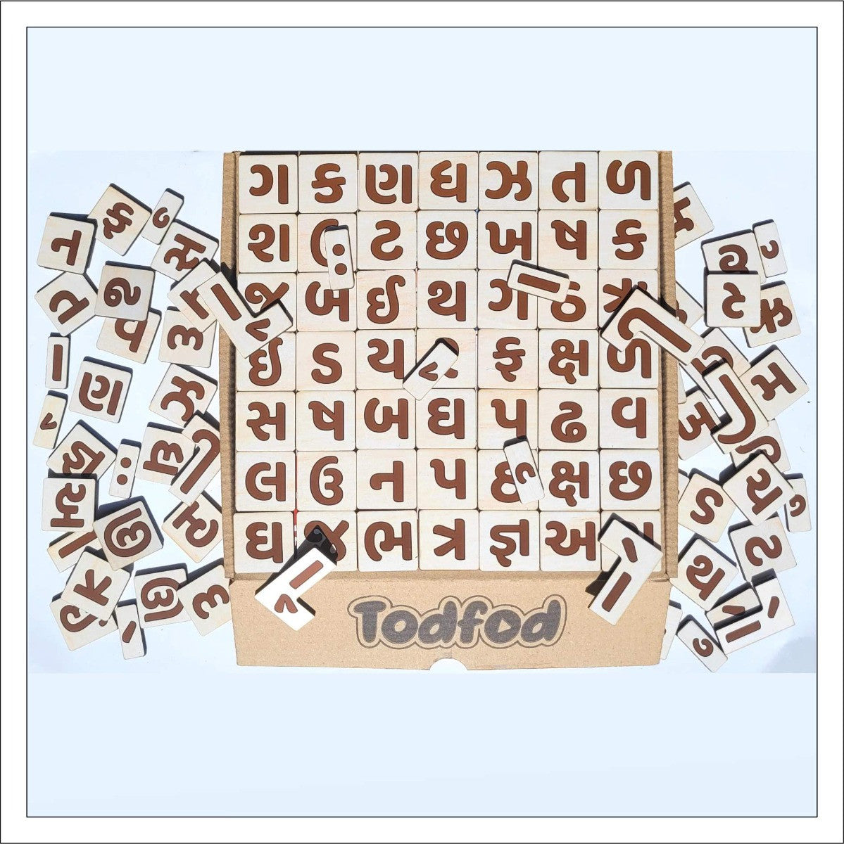 Wooden letter blocks with brown letters and Todfod branding on a light blue background