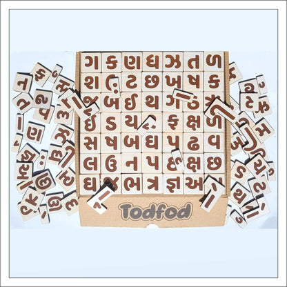 Wooden letter blocks with brown letters and Todfod branding on a light blue background