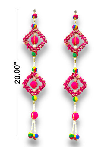 Colorful earrings with pink and multicolor beads on a white background