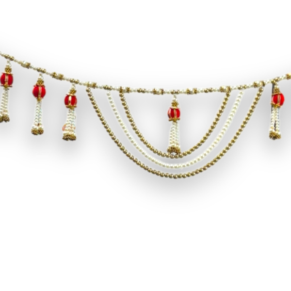 Decorative garland with red balls and gold chains on a white background