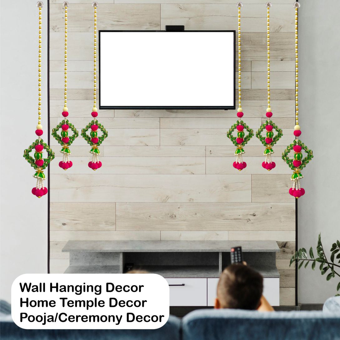 Wall hanging decor with red and green elements in front of a television.