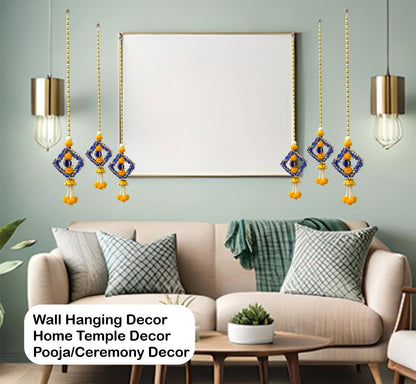 Living room with wall hanging decor, sofa, and framed artwork.