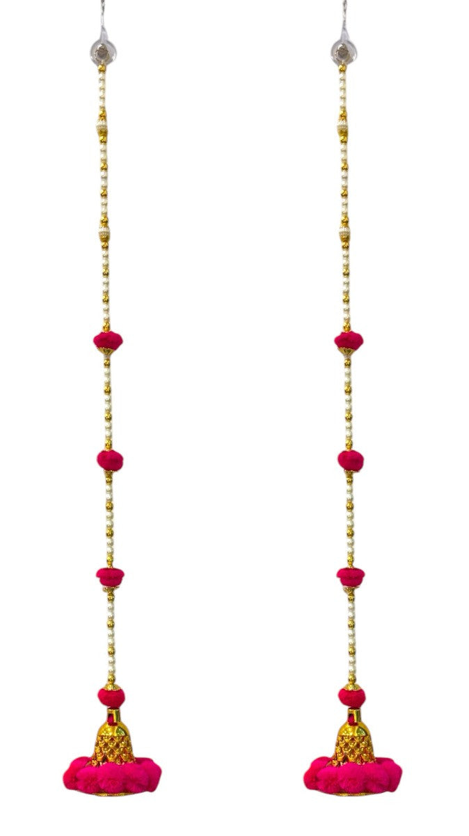 Long pink earrings with gold and red beads on a white background