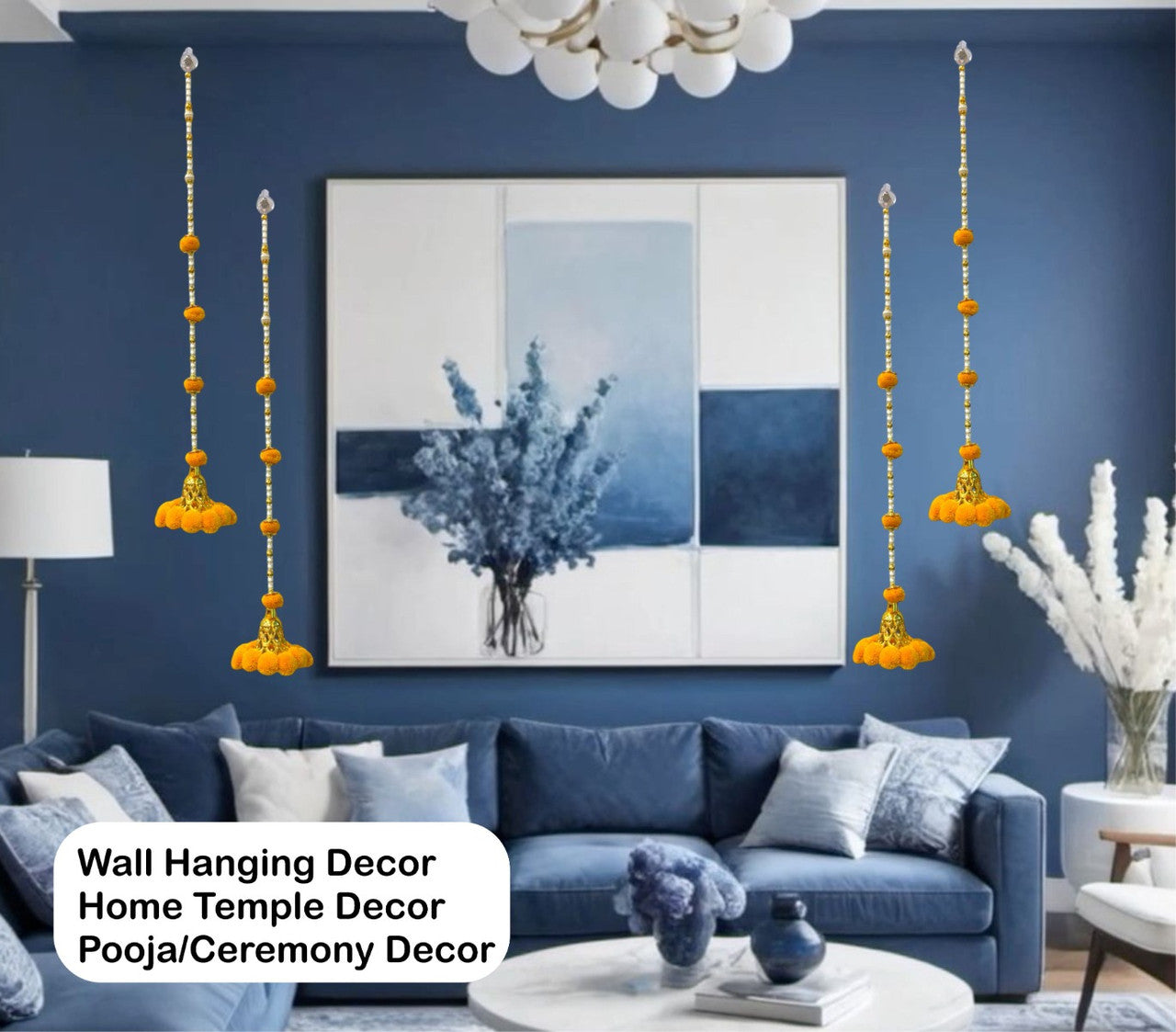 Living room with blue walls, a blue sofa, and wall hanging decor.