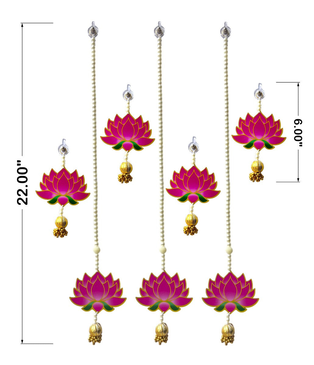 Set of pink lotus earrings with gold accents on a white background