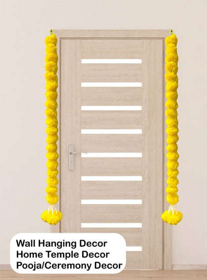 Yellow wall hanging decor on a door with text indicating use for home temple, pooja, and ceremony decor.
